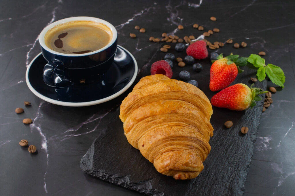 Coffee and a croissant from the Unwind kitchen