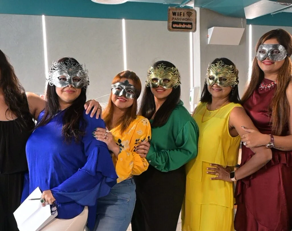 Guests in masks at an Unwind Masquerade Murder Mystery Party