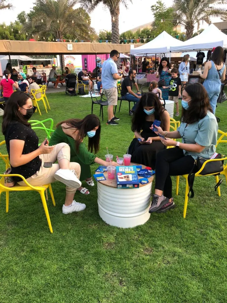 Guests playing board games at an Unwind outdoor event